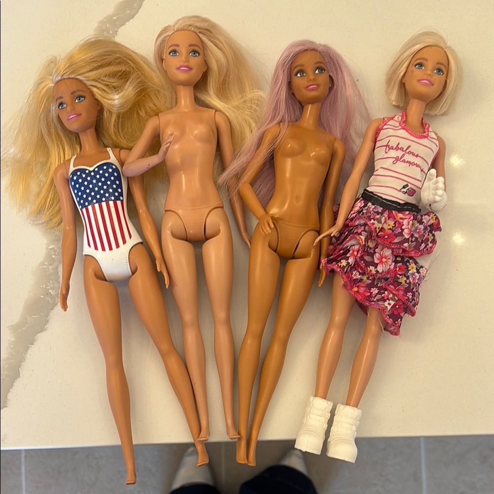 Set of Four Barbie Dolls with Blonde and Pink Hair